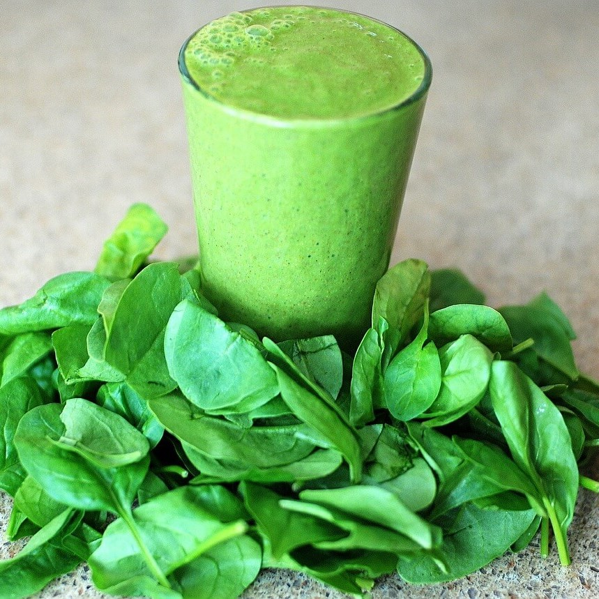 juice spinach in a juicer